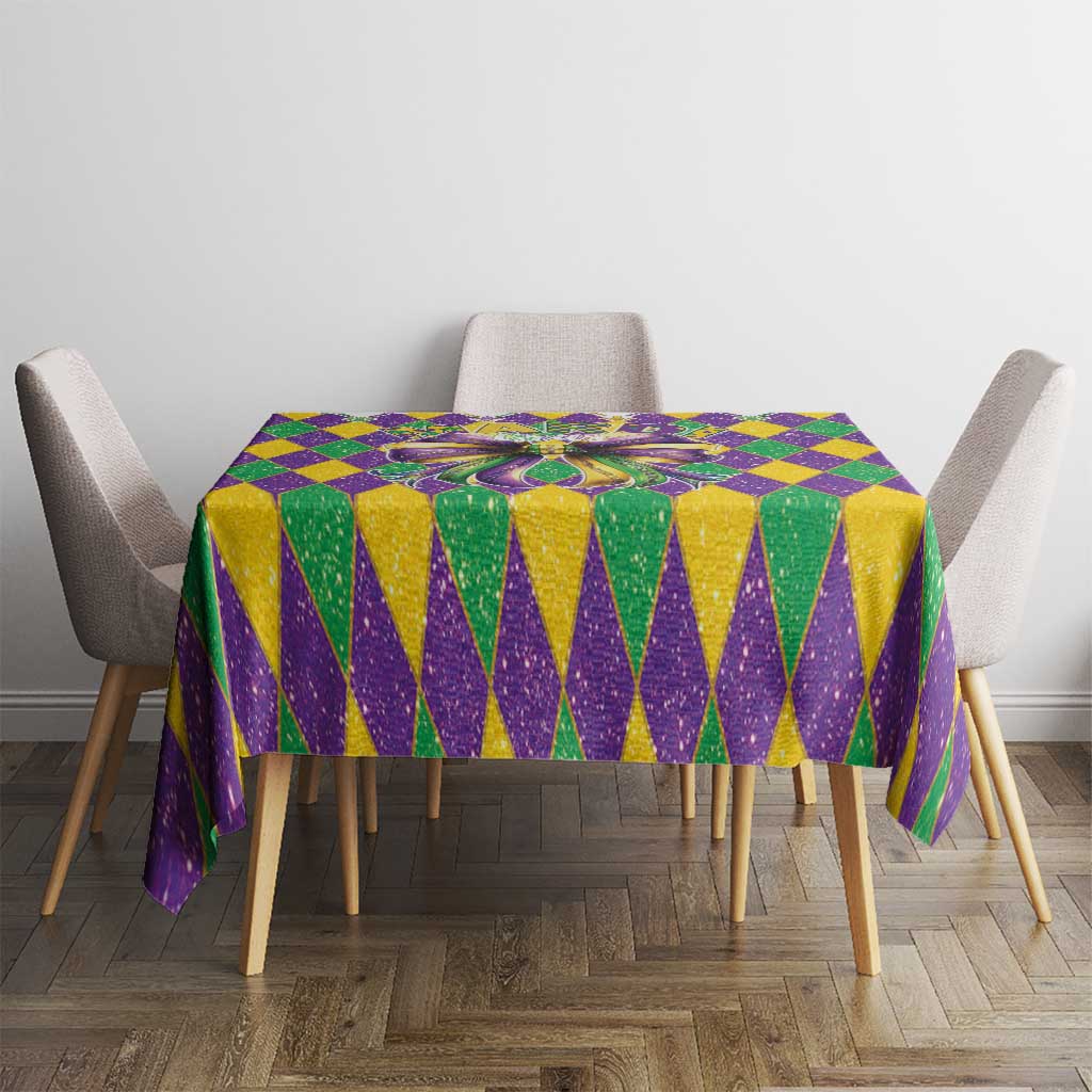 Purple and gold chevron diamond tablecloth with a multicolor glitter bow centerpiece