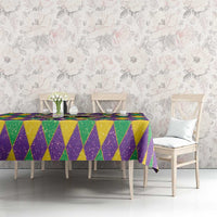 Purple, green, and gold glitter diamond tablecloth with multicolor bow detail