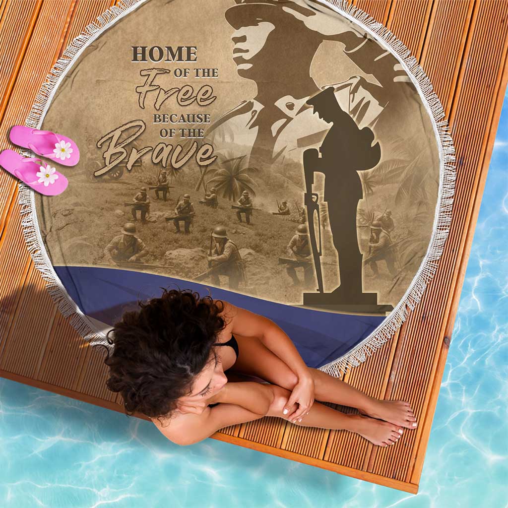 Round beach blanket with white fringe, brown 'HOME OF THE Free' and rifle silhouette