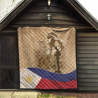 Tan quilt on exterior wall with soldier silhouette, 'Home of the Brave' text, and flag stripes