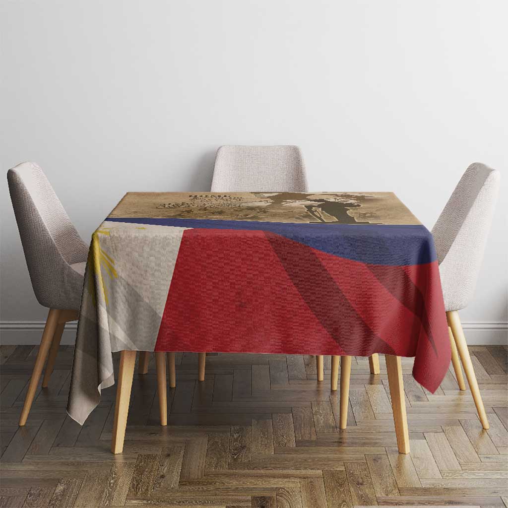 Brown commemorative tablecloth on dining table with blue and red stripe panel