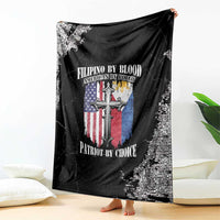Black grunge throw blanket draped over couch, cross and flag print with bold text
