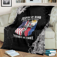 Black grunge throw blanket spread on couch, large cross-and-flag emblem and text
