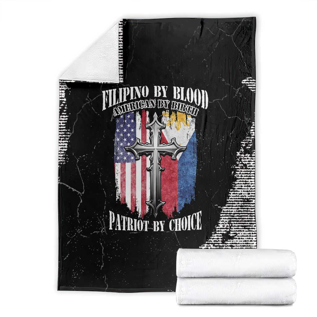 Black grunge throw blanket with cross-and-flag print, folded and stacked with white rolls