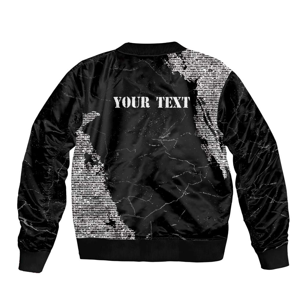 Black bomber jacket back with grunge text 'YOUR TEXT' and ribbed hem