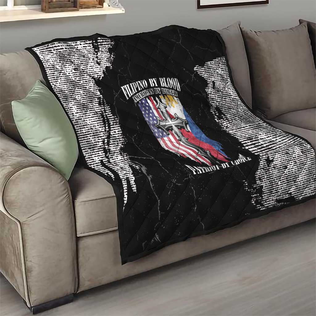 Black and white quilt blanket on a living room sofa, quilted diamonds with patriotic emblem