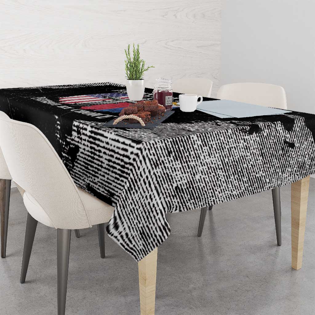 Black grunge-style tablecloth with bold distressed texture and graphic print along table edge