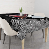 Black grunge-style tablecloth with bold distressed texture and graphic print along table edge