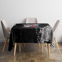 Black grunge-style tablecloth with distressed graphic print across tabletop center