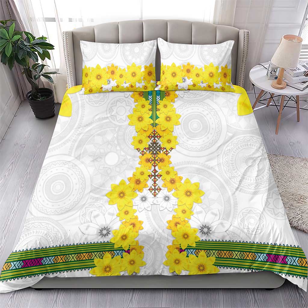 White bedding set with yellow floral cross print, two matching pillowcases, and multicolor trim border