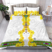White bedding set with yellow floral cross print, two matching pillowcases, and multicolor trim border