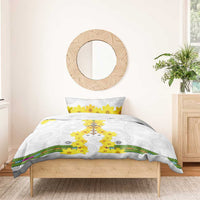White bedding set on wooden bed frame with yellow flower cross duvet and matching pillow, striped border