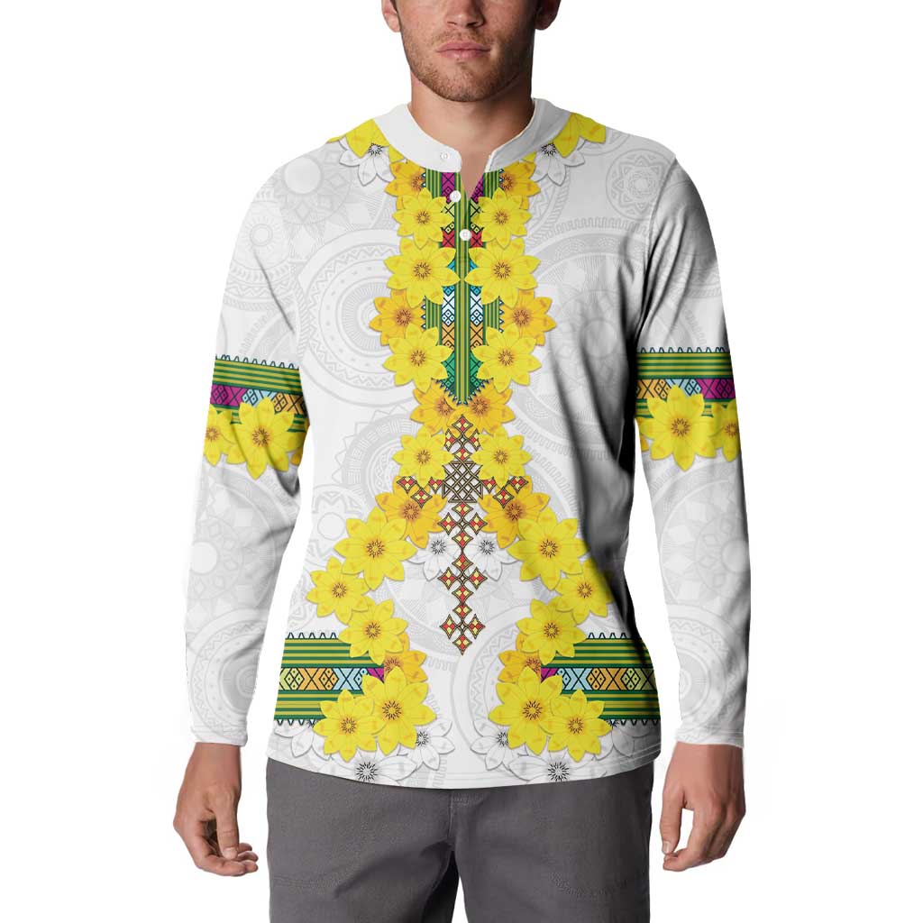 White long-sleeve sweatshirt with yellow floral front panel and multicolor trim at shoulders.