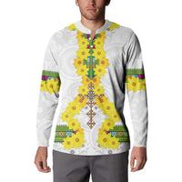White long-sleeve sweatshirt with yellow floral front panel and multicolor trim at shoulders.