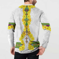 White long-sleeve sweatshirt back view with yellow flower garland and striped cuffs.