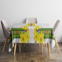 White tablecloth featuring yellow flower motifs and green patterned trim