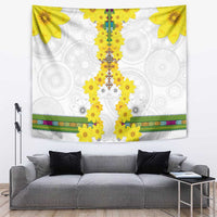 White wall tapestry with yellow flower motifs, central vertical design, and multicolor border