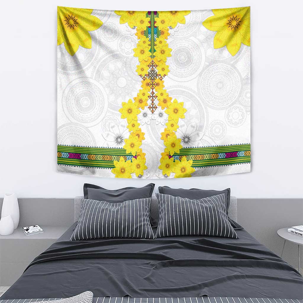 White wall hanging tapestry with yellow floral ornament columns and decorative multicolor stripe border