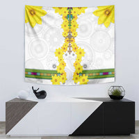 White tapestry with yellow flower cross-like centerpiece and patterned multicolor border strip