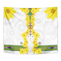 White tapestry close-up: yellow flower centerpiece, detailed central pattern, multicolor striped hem