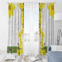 White window curtains with yellow vertical floral border and circular motif, ring-mounted