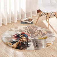 Beige round carpet with Kentucky Derby 151st text and colorful horse portraits