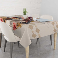Beige tablecloth with diamond pattern and rose artwork along the folded edge.