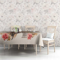 Beige tablecloth with rose print and subtle diamond pattern on a dining table.