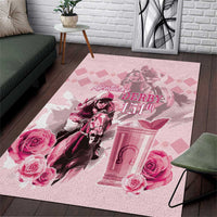 Pink anniversary horse racing area rug with stylized derby text, roses, and gate illustration.