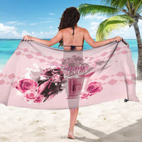 Pink horse-racing sarong with rose and 151st anniversary print, worn as a wrap