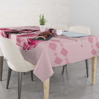 Pink tablecloth with rose and diamond print, draped over dining table