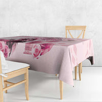 Pink tablecloth with rose and diamond pattern, hanging from table edge
