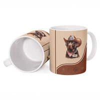 Brown ceramic mug shown from side with cowboy dog USA graphic; open top visible