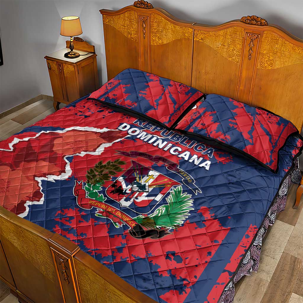 Quilt bed set with red and blue Dominican Republic map print, crest, and two pillows