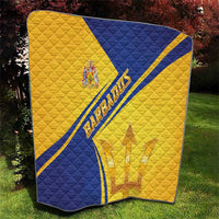 Barbados quilt blanket with blue diagonal sash, gold fabric, quilted texture and emblem
