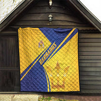Barbados quilt blanket hung outside, blue diagonal stripe, gold quilted surface and emblem