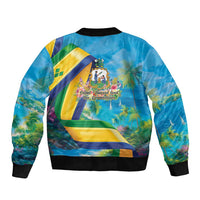 Blue bomber jacket with ribbed cuffs and back graphic with flag and island scene