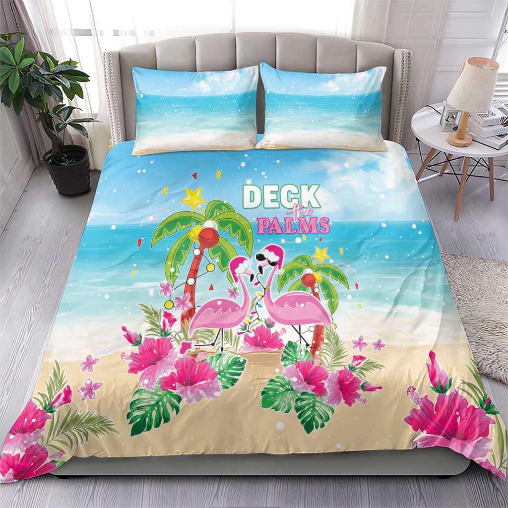 Blue and beige duvet cover and pillowcases with flamingos, palms, and flowers