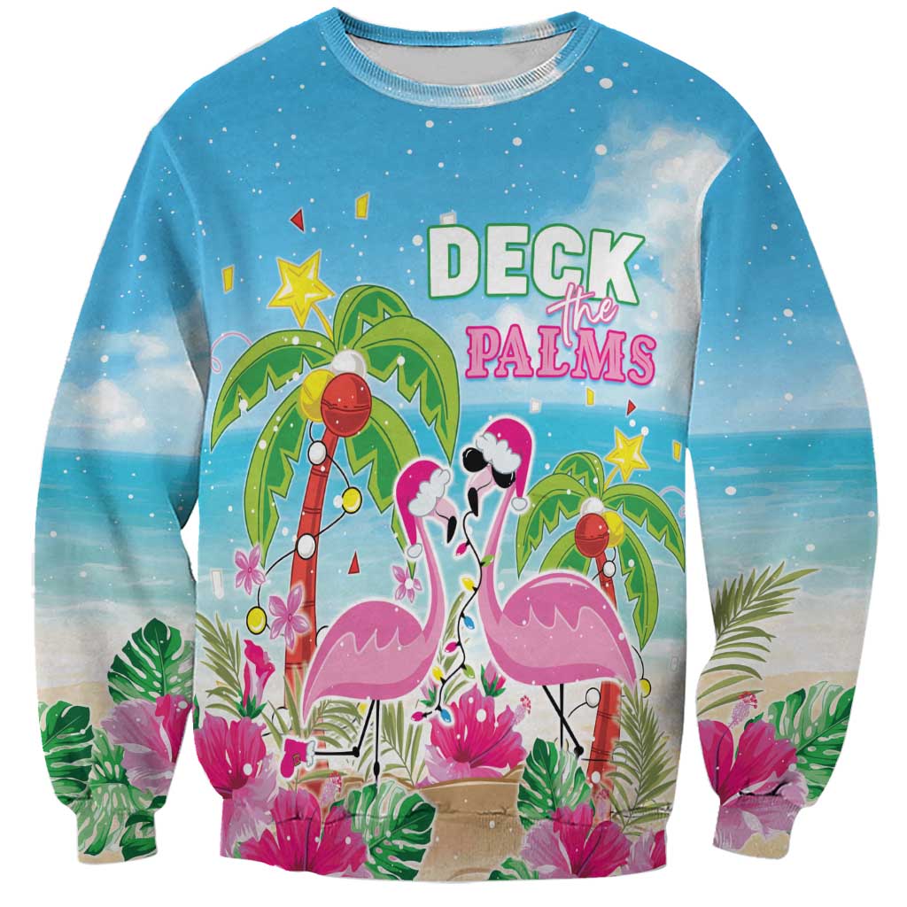Blue crewneck sweatshirt with flamingos, palms, and Deck the Palms holiday graphic