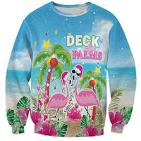 Blue crewneck sweatshirt with flamingos, palms, and Deck the Palms holiday graphic