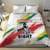 White bedding set with MLK portrait and multicolor paint-style rays on duvet cover