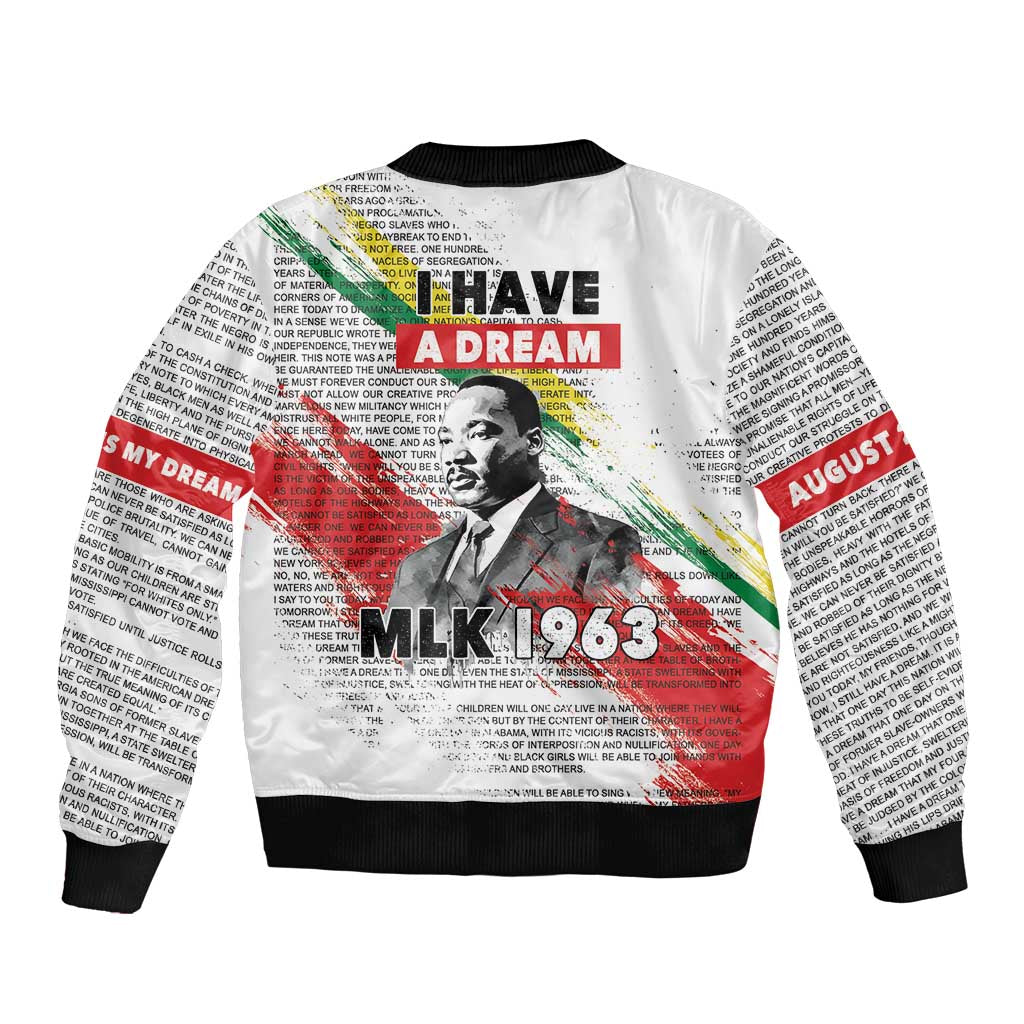 Unisex white bomber jacket with black ribbed cuffs, hem, and large back MLK 1963 print