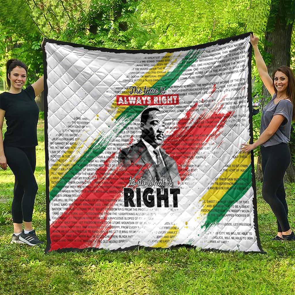 White large quilt with Martin Luther King portrait, “The time is always right” text and stripes