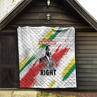 White quilt hanging on wall with diamond stitching, Martin Luther King portrait and stripes