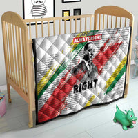 White quilt on toddler bed with diamond stitching, Martin Luther King portrait and colored stripes