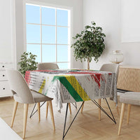 White tablecloth with Martin Luther King Jr portrait, rainbow text, and draped edges