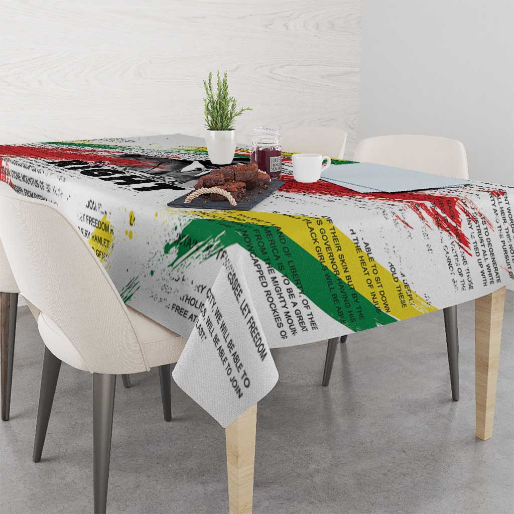 White tablecloth featuring Martin Luther King Jr portrait and multicolor quote text