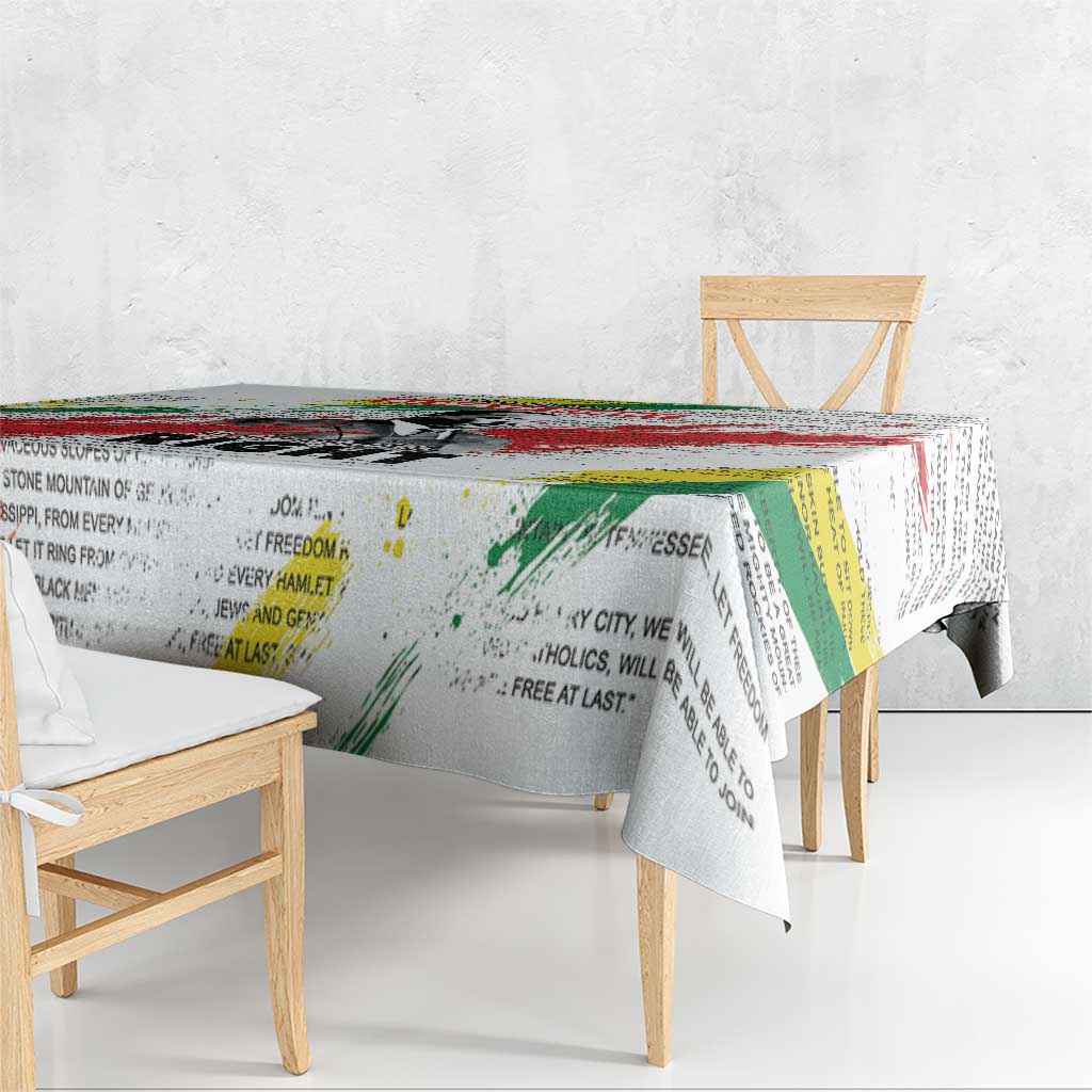White tablecloth with Martin Luther King Jr portrait and green-yellow-red text design