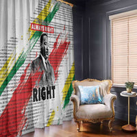 White window curtain with MLK portrait, bold red/green/yellow stripes and dense text