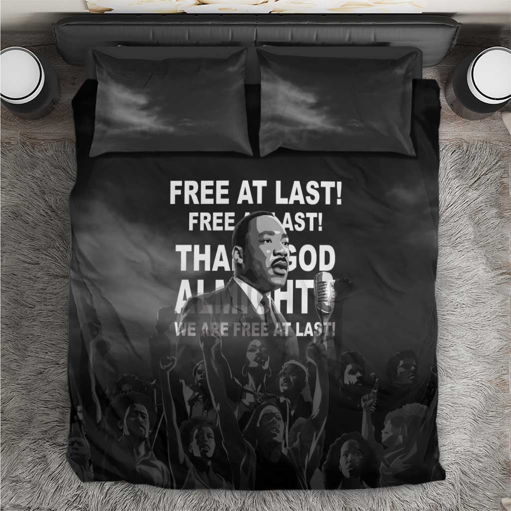 Black MLK bedding set with “Free at last” quote on duvet and two pillowcases